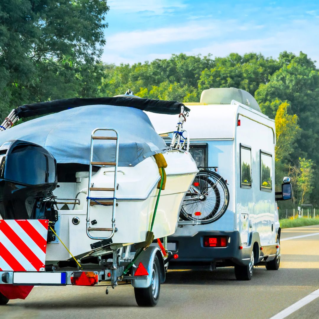 boat being hauled by an RV