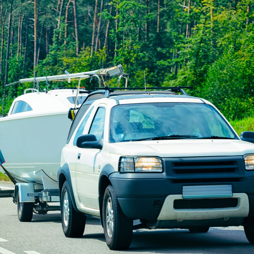 a car pulling a boat