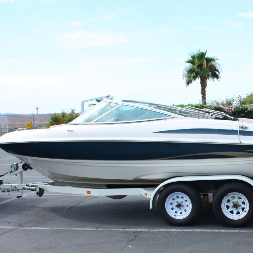 boat on trailer in parking lot